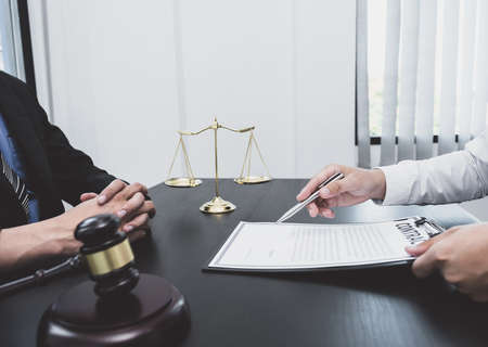 The male lawyer is providing service to consult business dispute to businessman.