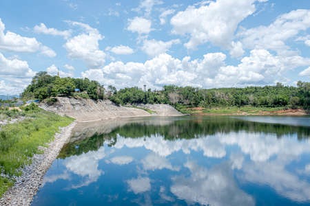 View of Mae Suai Dam, White Cloud Reservoir Beautiful sky, pagoda, and there is the reflection in...