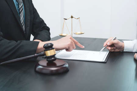 The male lawyer is providing service to consult business dispute to businessman.の写真素材