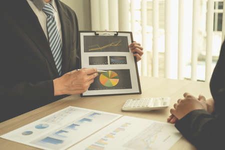 businessmen and businesswomen team meeting to plan strategies to increase business income. Have a...