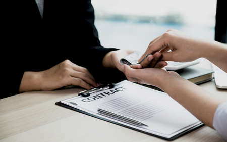 Government officials receiving bribe money from business man the concept of corruption and anti bribery.の写真素材