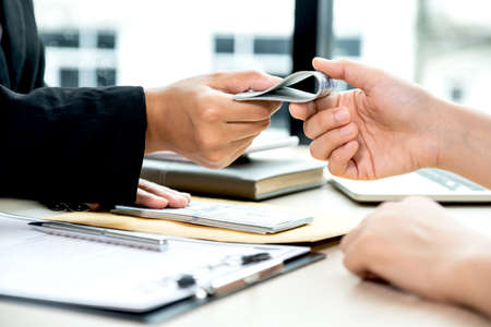 Government officials receiving bribe money from business man the concept of corruption and anti...