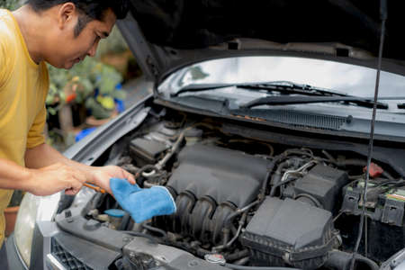 The driver is checking the car before traveling, safety first concept.の写真素材