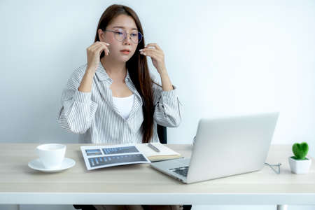 Young Asian teachers are teaching fun online from their home office, social distancing teaching concept during COVID virus diseases.の写真素材