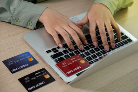 Businesswoman use credit card to online shopping from home with laptop, payment e-commerce, internet...