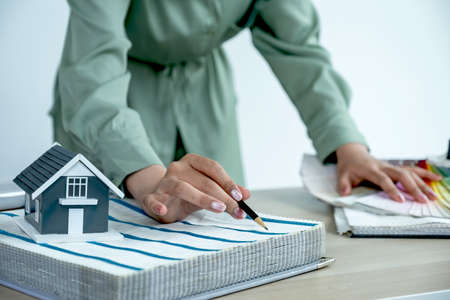 Property and interior agents are presenting houses and curtains for interior decoration.