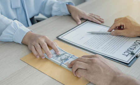 officials receiving bribe money from business man the concept of corruption and anti bribery.