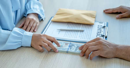officials receiving bribe money from business man the concept of corruption and anti bribery.