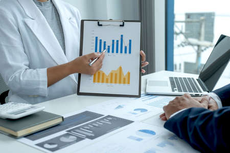 businesswoman and businessmen team meeting to plan strategies to increase business income....