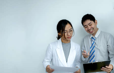 businesswoman and businessmen team meeting to plan strategies to increase business income. Have a brainstorming graph analysis and discussing for the new target success.の写真素材