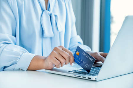 Consumer woman hand holding a mock up credit card, Ready to spending pay online finance shopping...