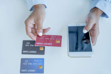 Consumer woman hand holding a mock up credit card, ready to spending pay online finance shopping...