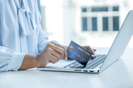 Consumer woman hand holding a mock up credit card, Ready to spending pay online finance shopping...