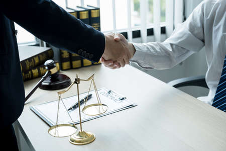 Handshake after Lawyer  providing legal consult business dispute service to the man at the office...