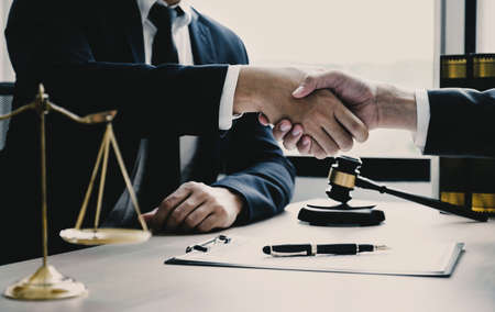 Handshake after Lawyer providing legal consult business dispute service to the man at the office...