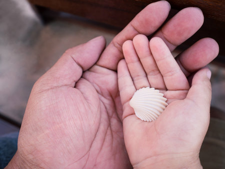 Close up Asian parent hand holding baby fingers, Love family concept.の写真素材