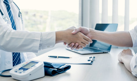 Handshake after doctor explained the health examination results to the patient, medical checkup concept.の写真素材