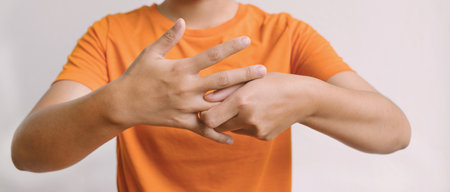 Woman hand massage physiotherapy other side is sore and numb, exhausted, tingling. Guillain-Barre Syndrome, a side effect of the Covid-19 vaccination.の写真素材