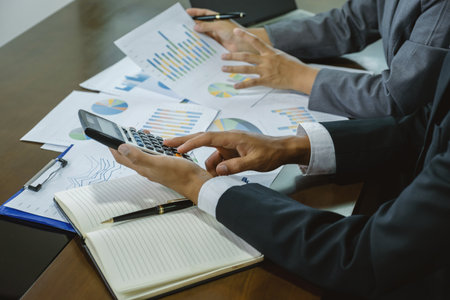 businessmen and businesswomen team meeting to plan strategies to increase business income. Have a...