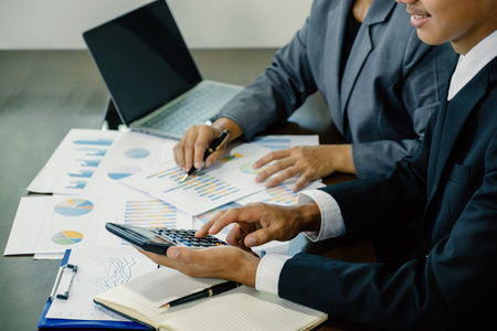 businessmen and businesswomen team meeting to plan strategies to increase business income. Have a brainstorming graph analysis and discussing for the new target successの写真素材