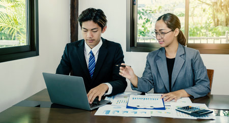 businesswomen and businessmen team meeting to plan strategies to increase business income. Have a brainstorming graph analysis and discussing for the new target successの写真素材