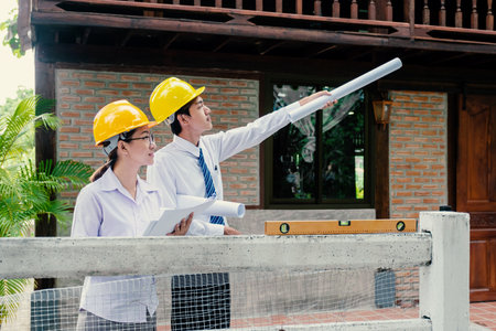 A team of engineers, contractors, meetings for housing projects, industry, work safety plans and design review.の写真素材