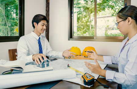 A team of engineers, contractors, meetings for housing projects, industry, work safety plans and design review.の写真素材