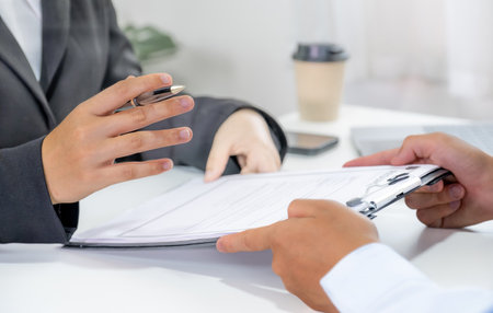 Office executives interviewing job applicants in the meeting room. employer conversation summary work employment.の写真素材