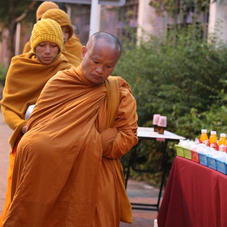 monks begging alms in the early morning in chiang mai ,thailandのeditorial素材