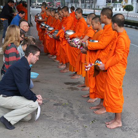 monks begging alms in the early morning in chiang mai ,thailandのeditorial素材