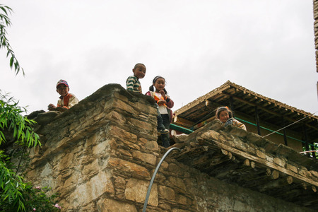 children on the national architecture in danba,sichuan,chinaのeditorial素材