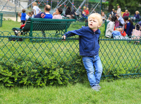 boy in the garden in paris, franceのeditorial素材