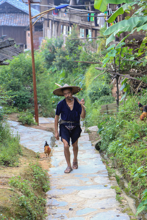 man in ba Sha miao village ,guinzhou province,chinaのeditorial素材