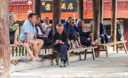 seniors having their rest on long benchのeditorial素材