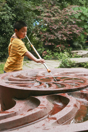 boy playing in living water garden,chengdu,chinaのeditorial素材