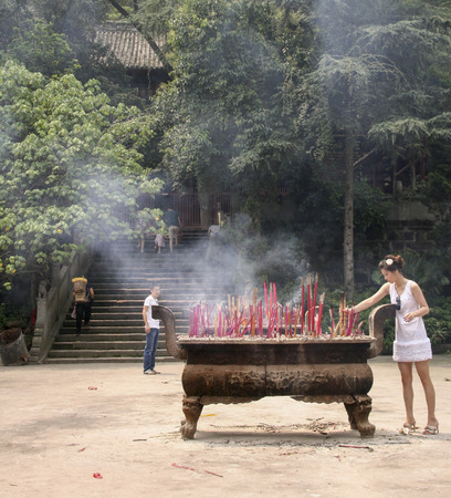 burning incenses in shijing temple ,chengdu,chinaのeditorial素材