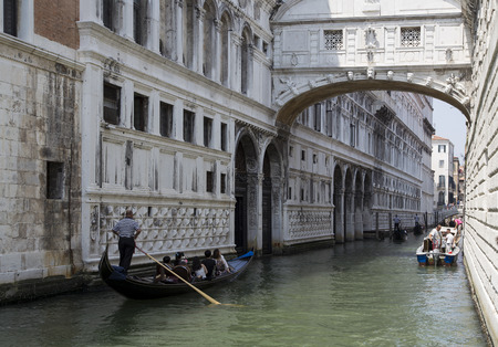 visitors in the launch going across the bridge of sighs, in venice,Italyのeditorial素材