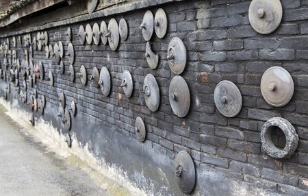 Black clayware on the wall in sichuan,chinaの写真素材