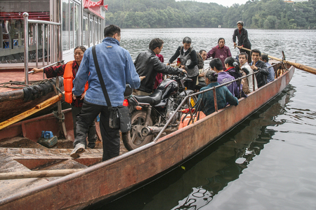 boat in black dragon beach scenic spot, sichuan, chinaのeditorial素材