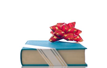 blue book with ribbon from front view on white backgroundの写真素材