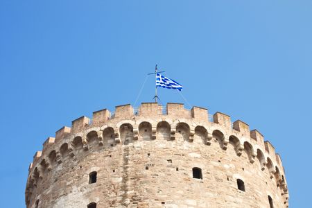Part of white tower with greece flagの写真素材