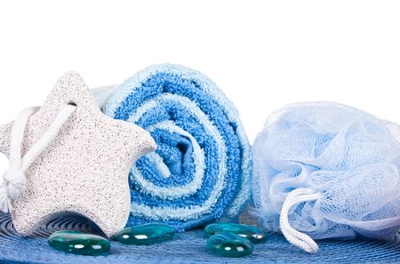 blue towel footstone sponge stones on blue mat and white background