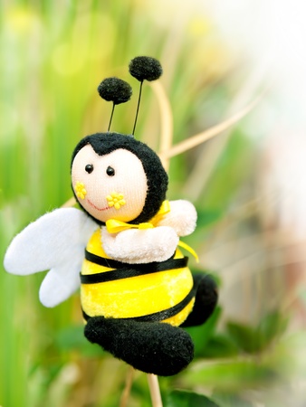 bee toy as decoration for flowerpotの写真素材
