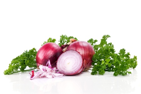 Red sliced onion and fresh parsley still life isolated on white backgroundの写真素材