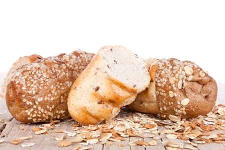 sliced loaf of multigrain bread, on white background