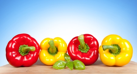 Colorful fresh mixed bell peppers isolated on white backgroundの写真素材