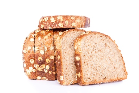 sliced loaf of multigrain bread, on white background