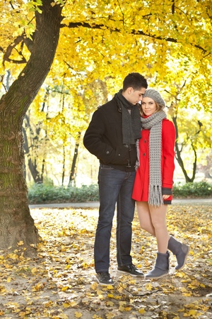
young love couple walking in autumn park, enjoying together  の写真素材