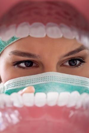 dentist examining teeth view  from open mouth