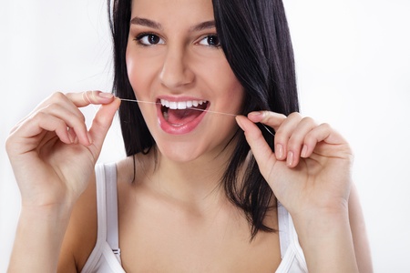Woman flossing teeth, dental careの写真素材